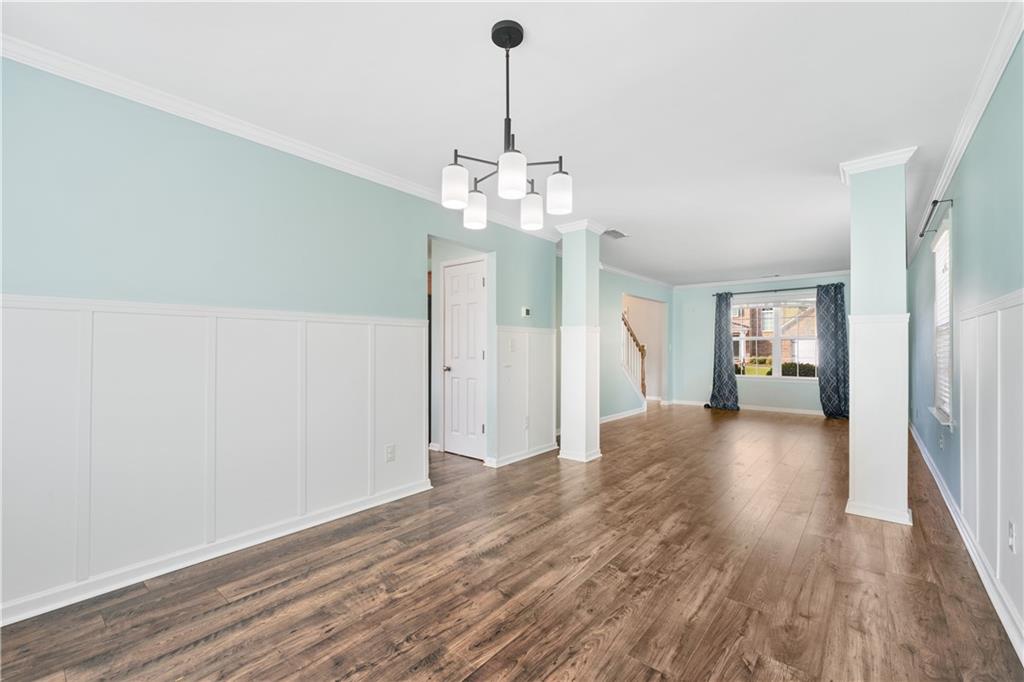 871 New Liberty Way Braselton, GA 30517 - Photo 7 of 47 a view of a livingroom with wooden floor