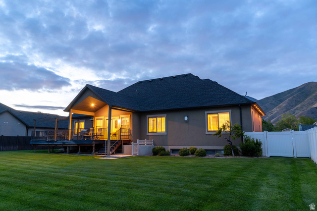 646 East 1400th Street North Mapleton, UT 84664 - Photo 63 of 78 Expansive backyard with a manicured lawn, a large deck, and a covered patio area