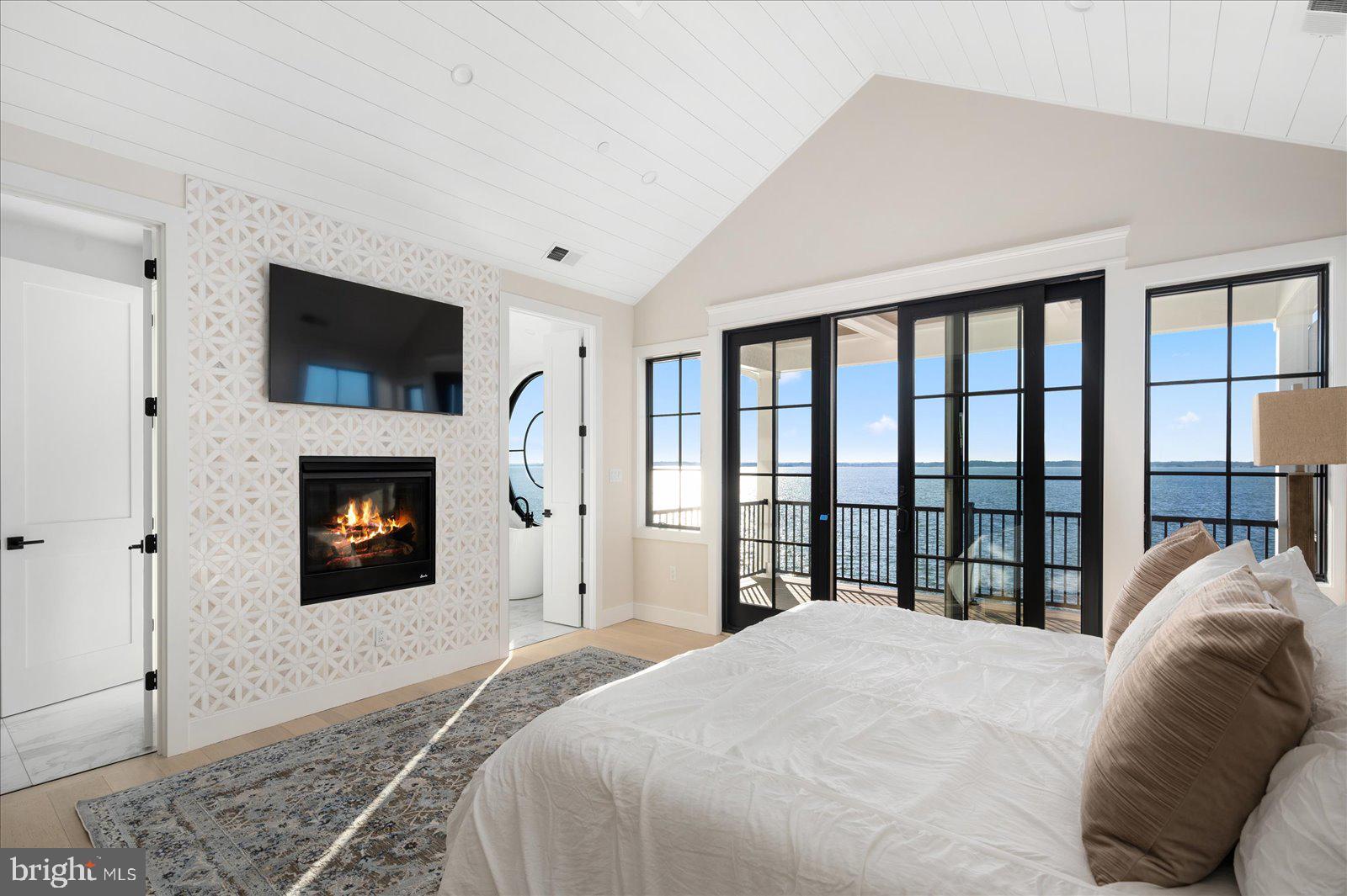 10615 Point Lookout Road Ocean City, MD 21842 - Photo 56 of 150 Primary bedroom with gas fireplace