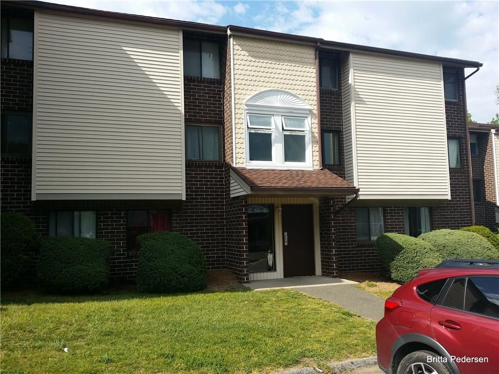 7 Padanaram Road, Unit D91 Danbury, CT 06811 - Photo 1 of 1 a front view of a house with a yard