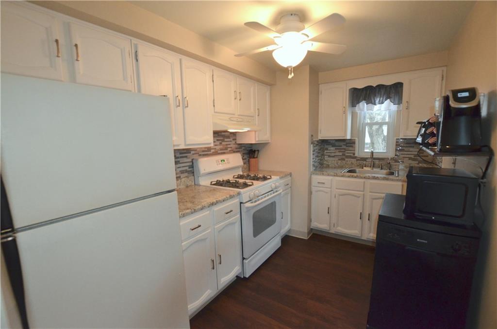 255 Castle Road Castle Shannon, PA 15234 - Photo 6 of 14 Updated kitchen with new backsplash, countertops and ceiling fan...as well as updated cabinetry. Enough room to put a small table and two chairs along the wall to have your morning coffee!