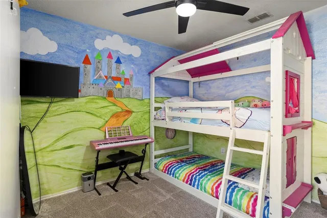 a bedroom with a bed and a bookshelf