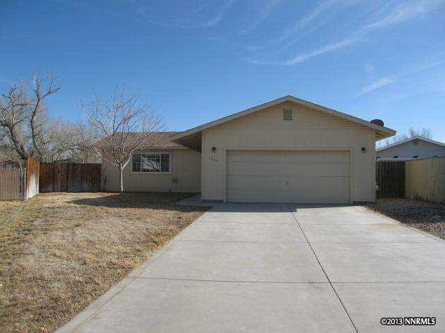 a front view of a house with a garage