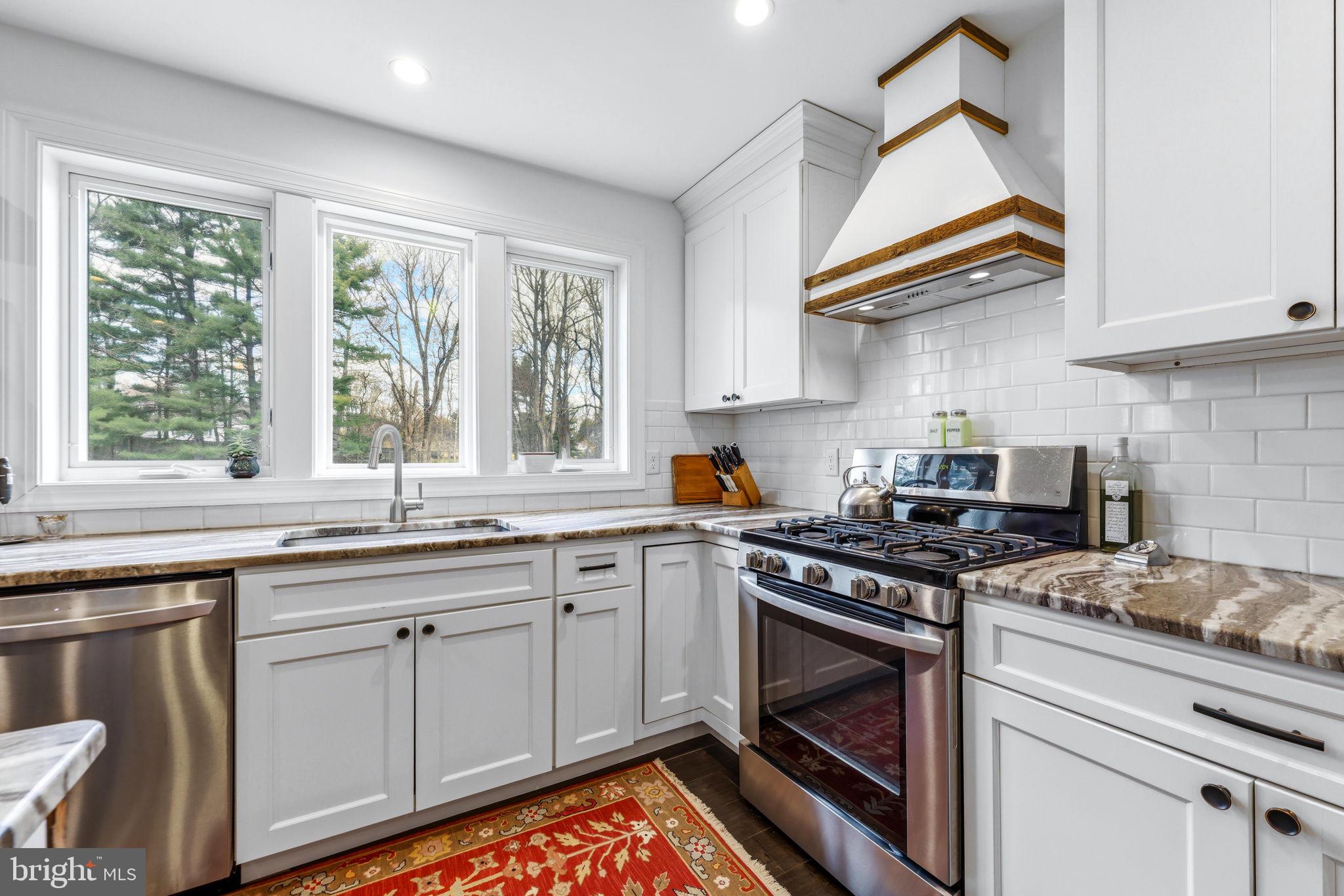 4126 Hedgehill Lane Phoenix, MD 21131 - Photo 22 of 54 a kitchen with appliances cabinets and a sink