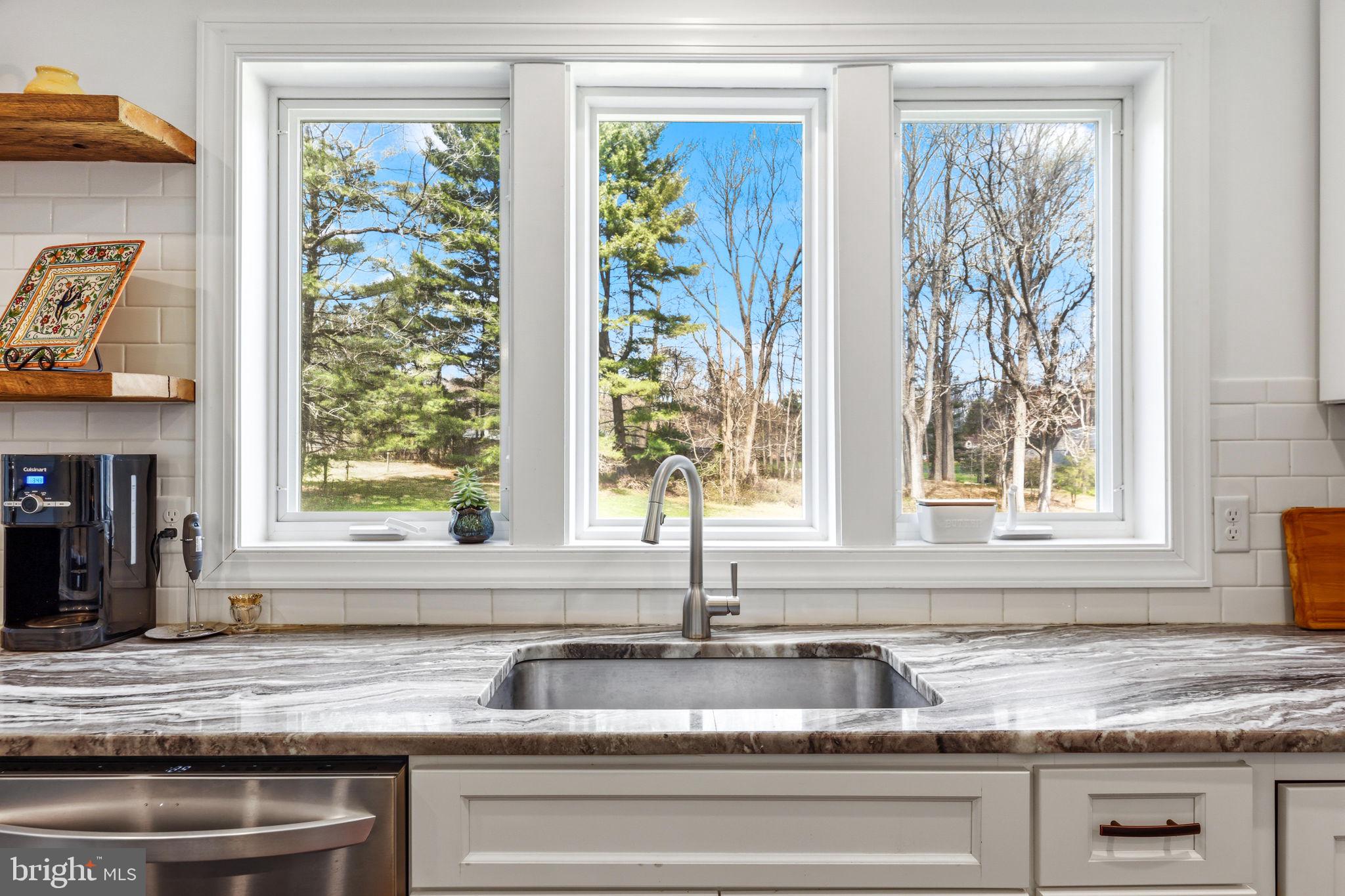 4126 Hedgehill Lane Phoenix, MD 21131 - Photo 24 of 54 a kitchen with granite countertop a sink and a window