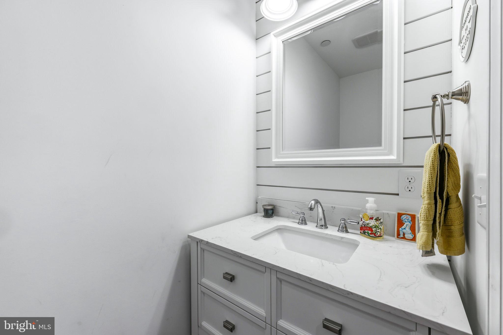 4126 Hedgehill Lane Phoenix, MD 21131 - Photo 26 of 54 a bathroom with a sink and a mirror