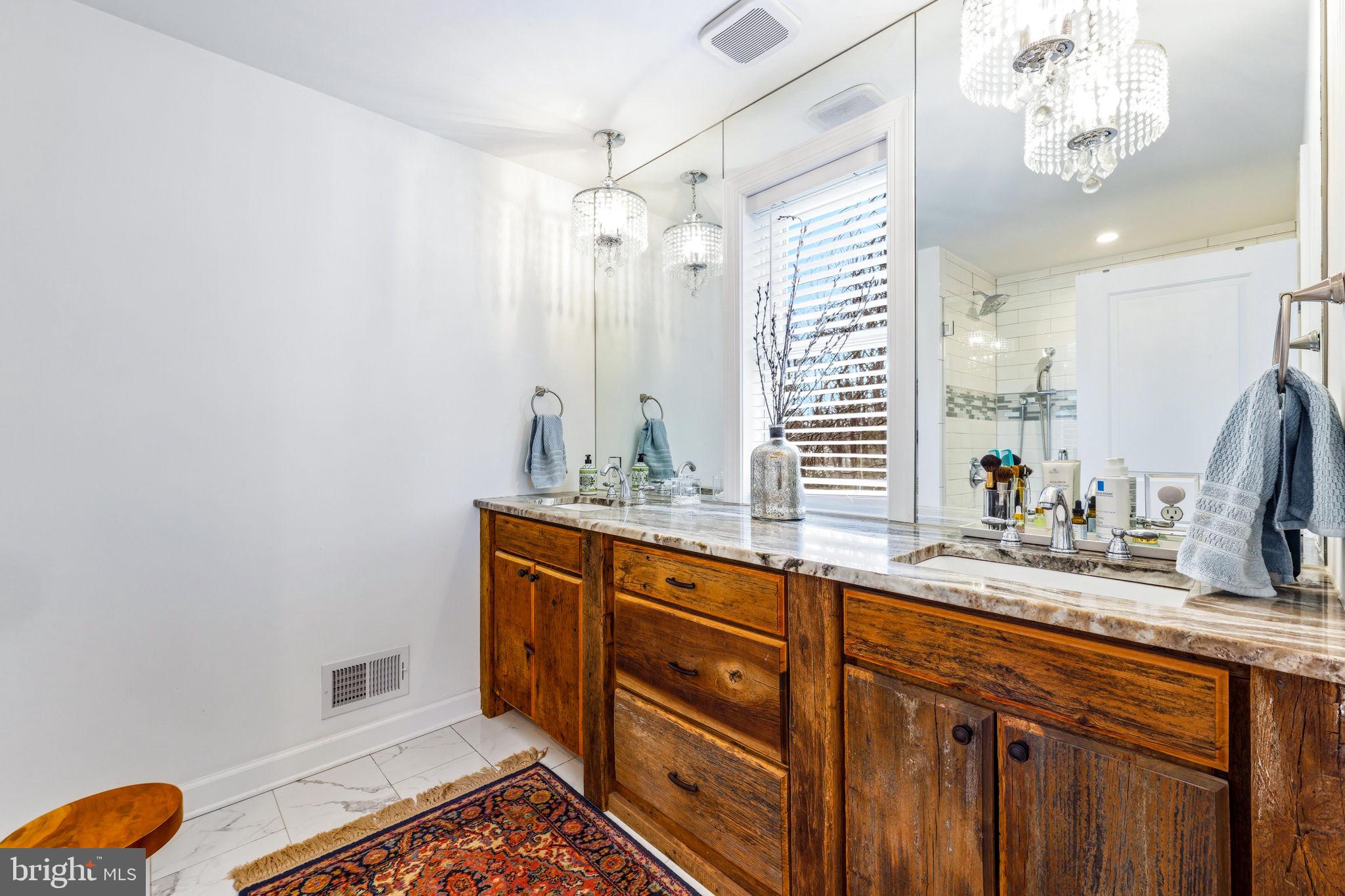 4126 Hedgehill Lane Phoenix, MD 21131 - Photo 31 of 54 a spacious bathroom with a double vanity sink mirror and