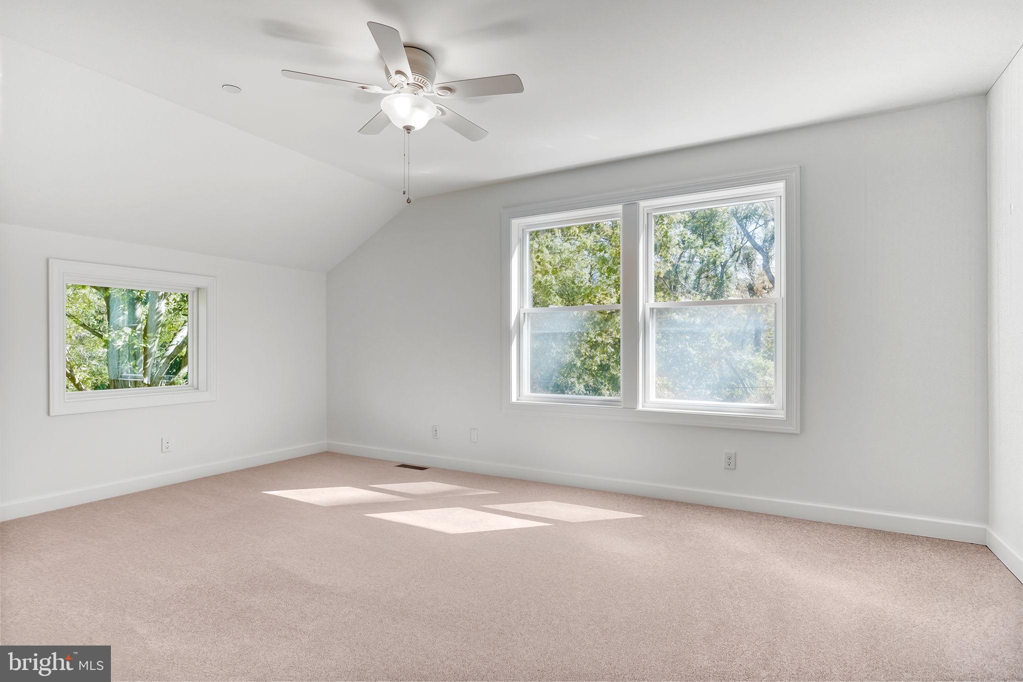 4126 Hedgehill Lane Phoenix, MD 21131 - Photo 38 of 54 an empty room with windows and fan