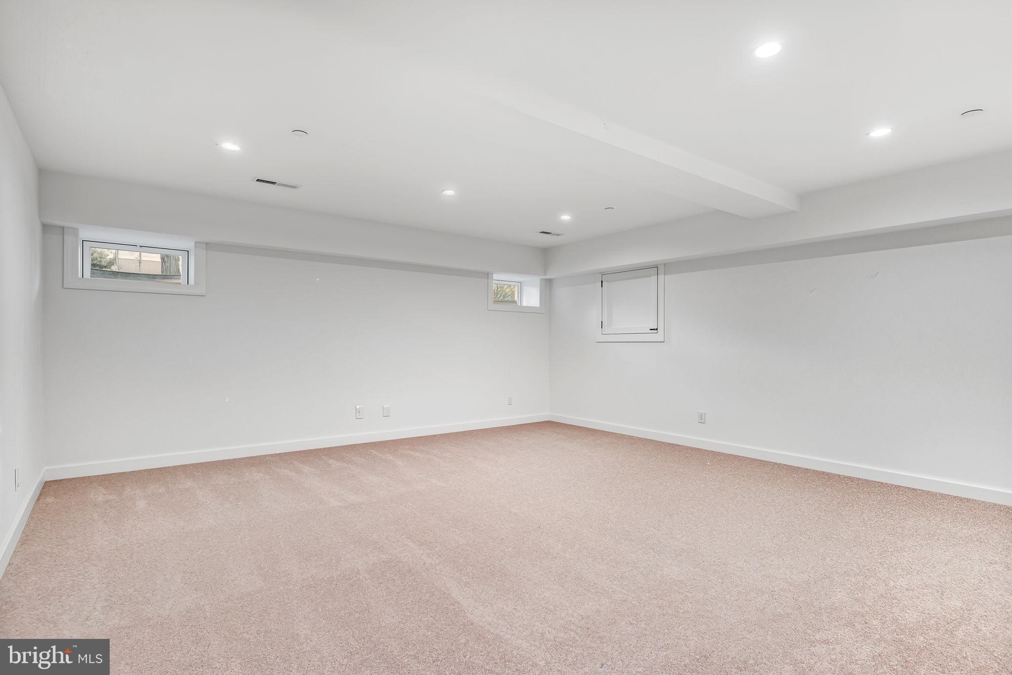 4126 Hedgehill Lane Phoenix, MD 21131 - Photo 40 of 54 an empty room with a empty space and windows
