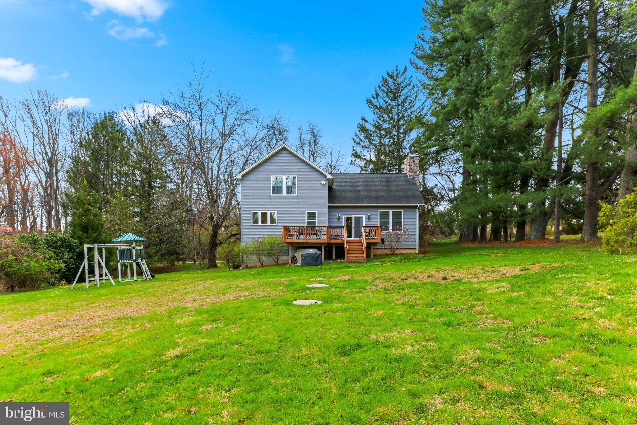 4126 Hedgehill Lane Phoenix, MD 21131 - Photo 47 of 54 a view of a house with a big yard and large trees