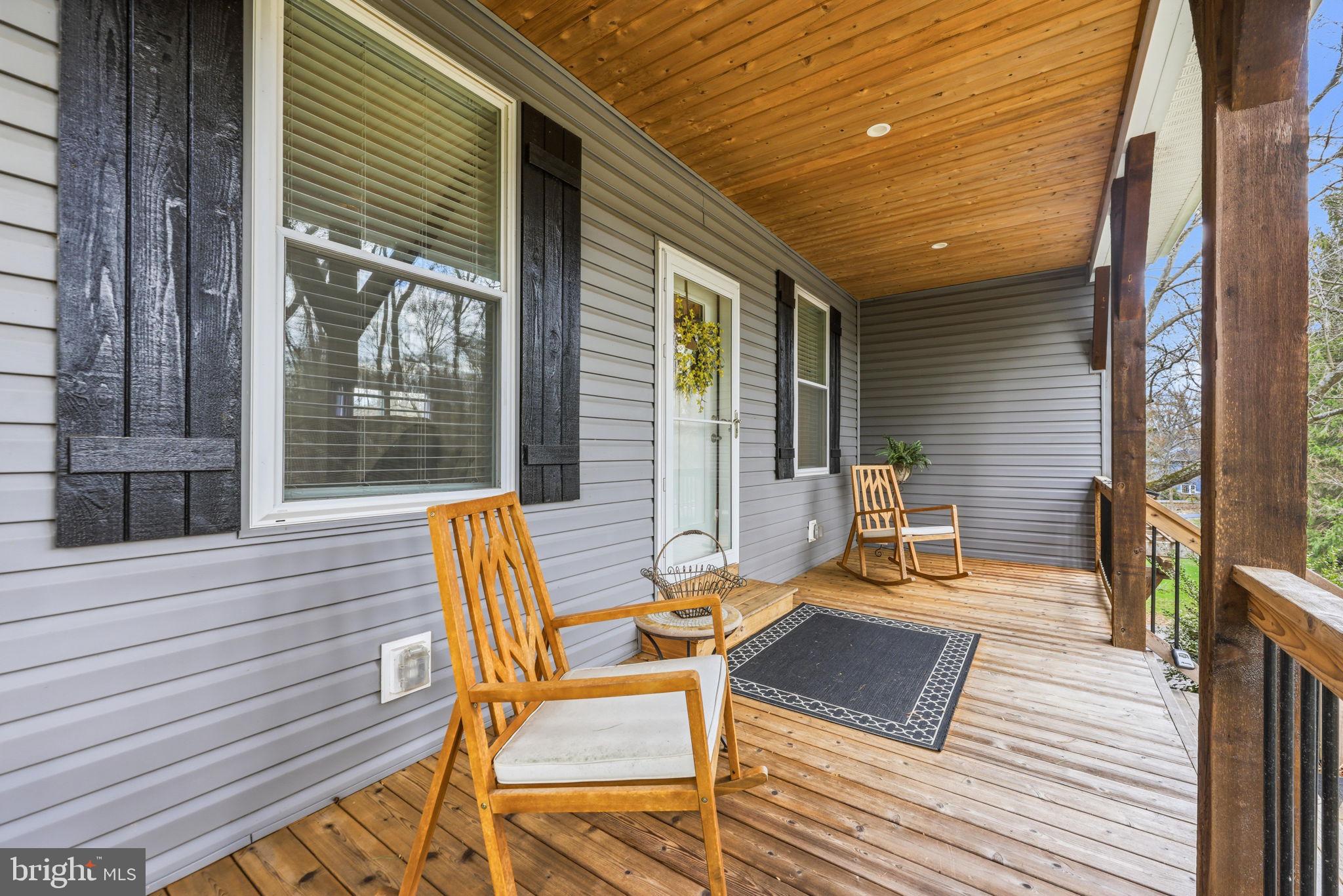 4126 Hedgehill Lane Phoenix, MD 21131 - Photo 10 of 54 a backyard of a house with outdoor seating