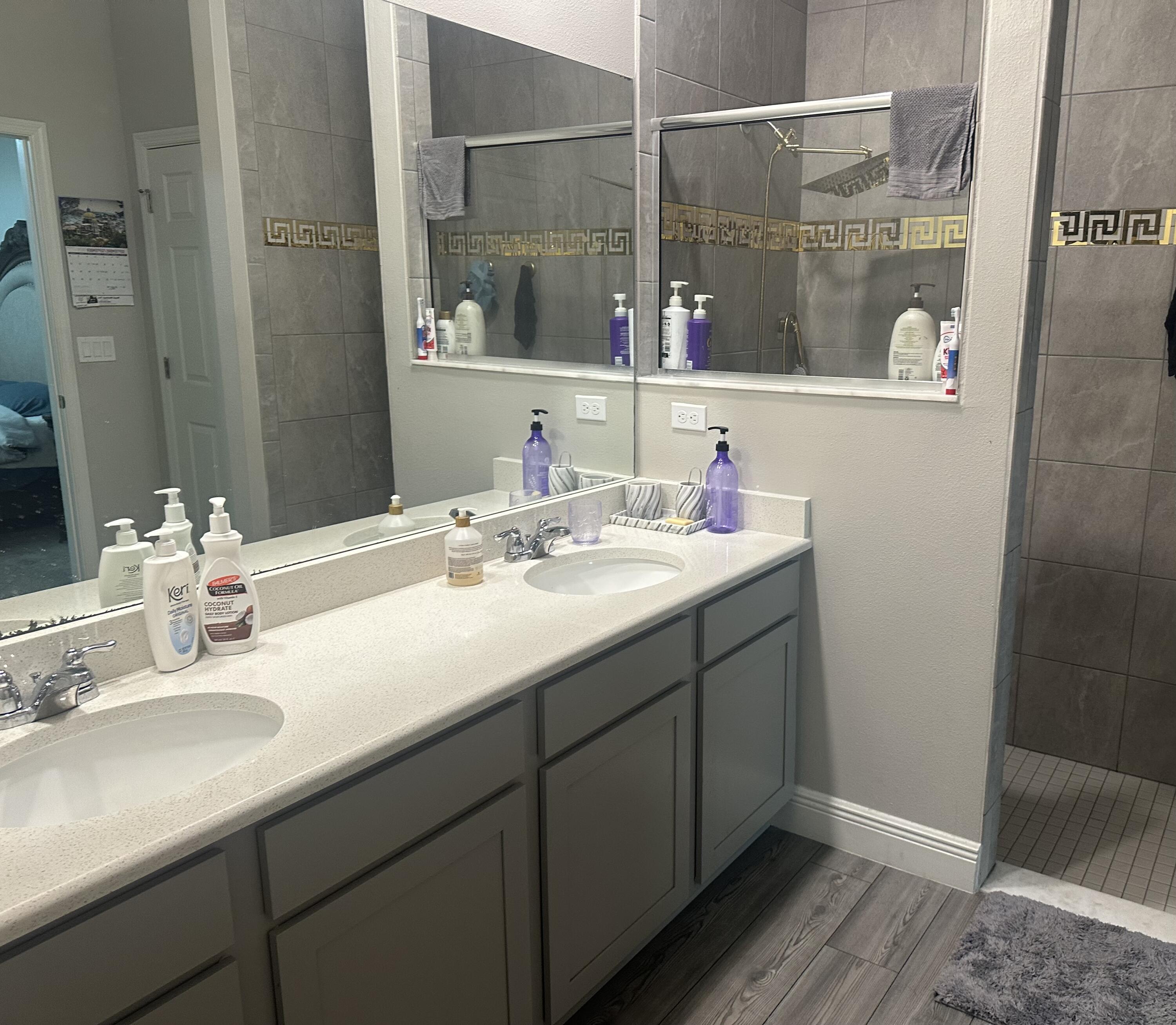 1218 Southwest Parma Avenue Port St. Lucie, FL 34953 - Photo 7 of 11 a bathroom with a sink and a mirror