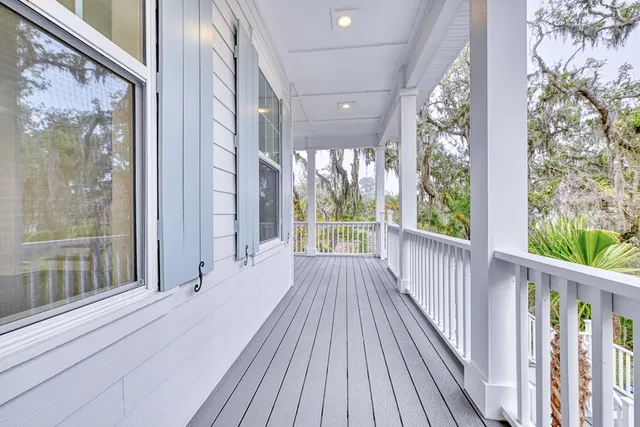 a view of a balcony with wooden floor