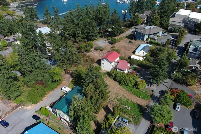 an aerial view of a house with a yard