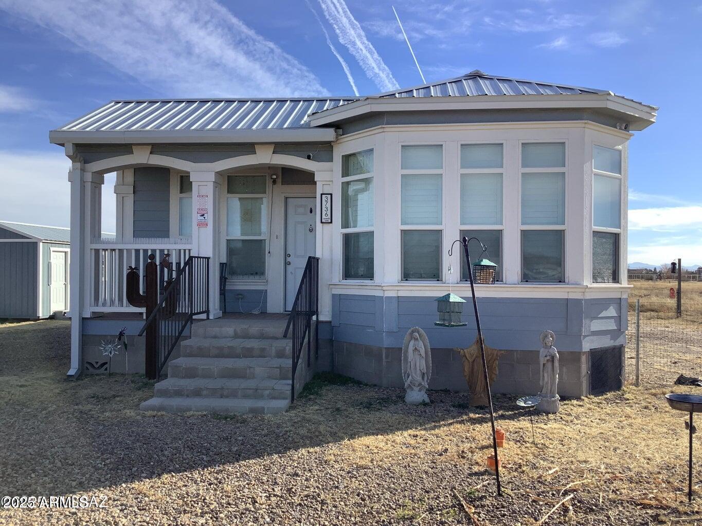3736 Jackson Lane Willcox, AZ 85643 - Photo 1 of 36 a view of a house with wooden fence
