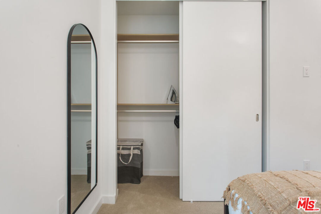 10310 Santa Monica Boulevard, Unit 612 Los Angeles, CA 90025 - Photo 14 of 37 a view of bedroom with a wardrobe space