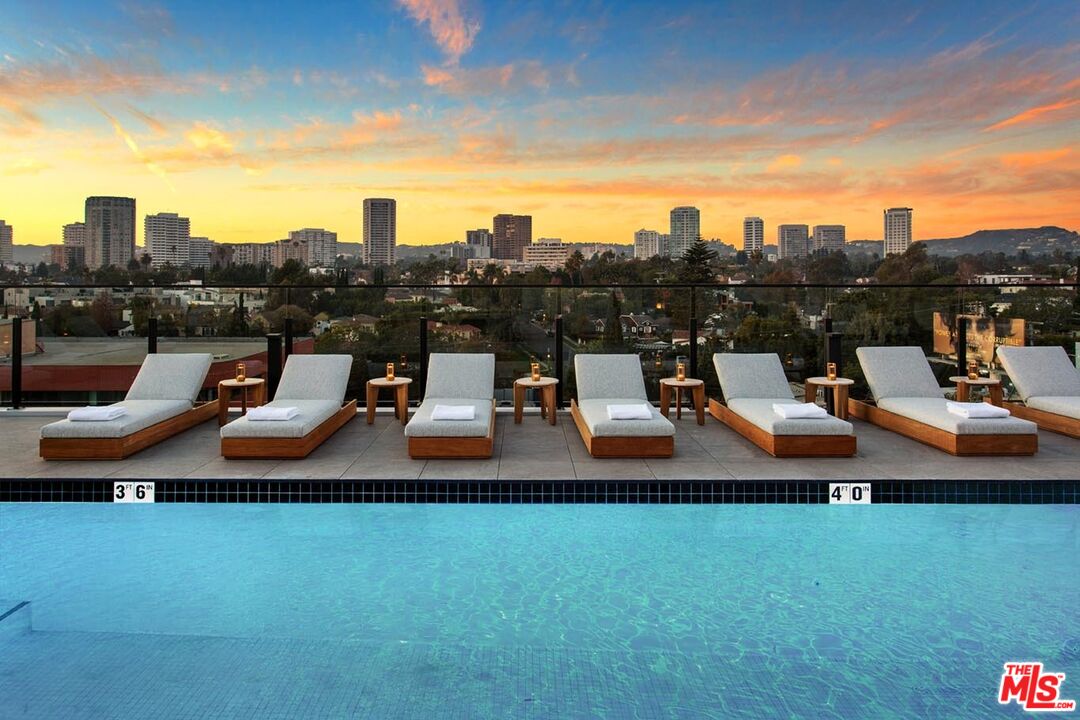 10310 Santa Monica Boulevard, Unit 612 Los Angeles, CA 90025 - Photo 23 of 37 a terrace with outdoor seating and city view