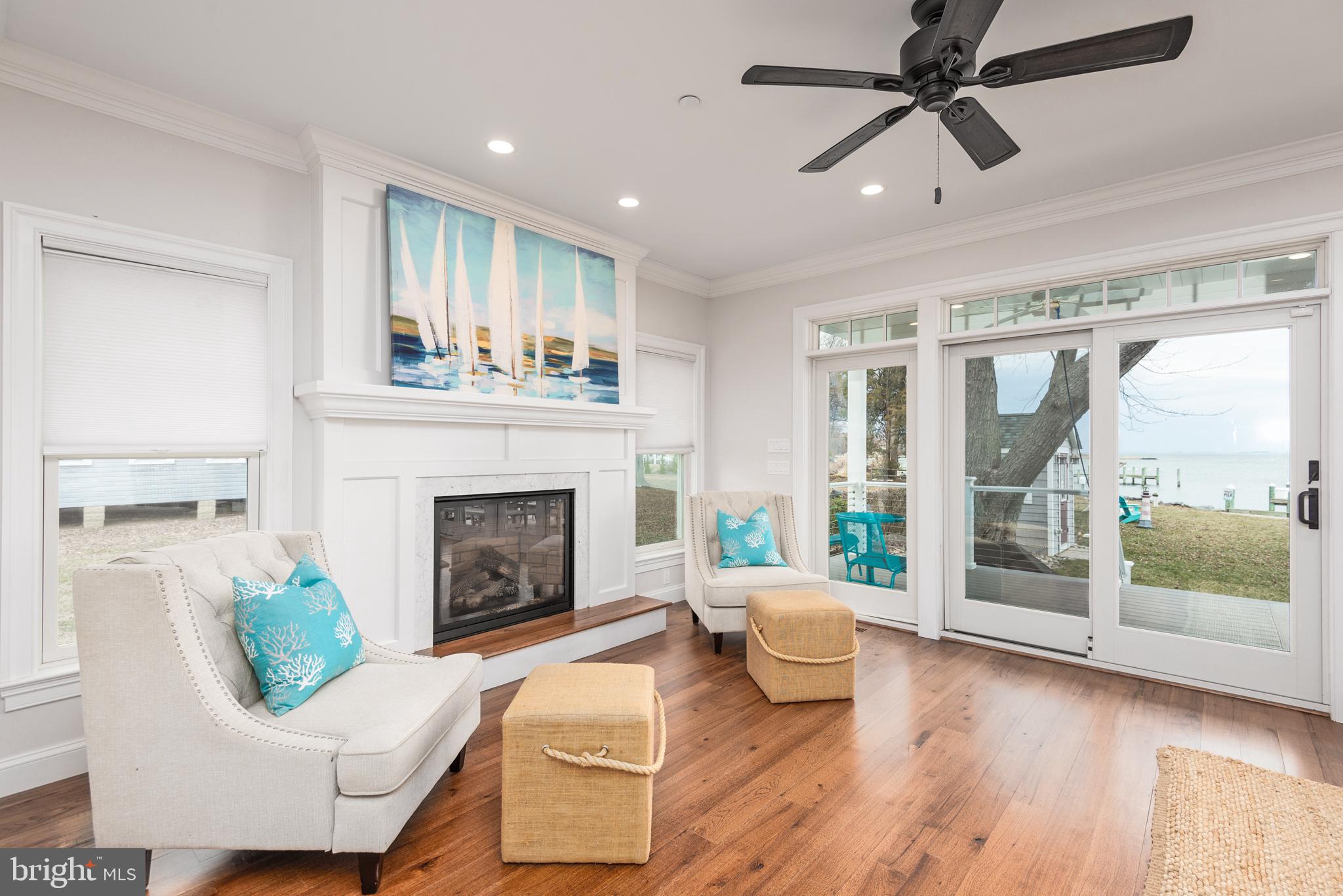 1538 Robinson Road Shady Side, MD 20764 - Photo 12 of 71 a living room with furniture and a fireplace