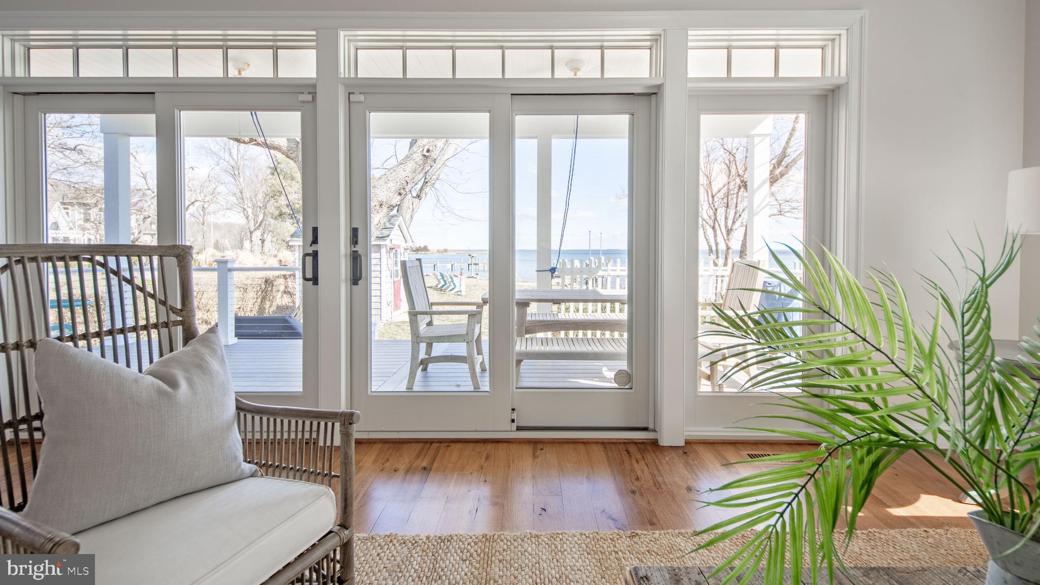 1538 Robinson Road Shady Side, MD 20764 - Photo 19 of 71 a view of a porch with wooden floor and a bench