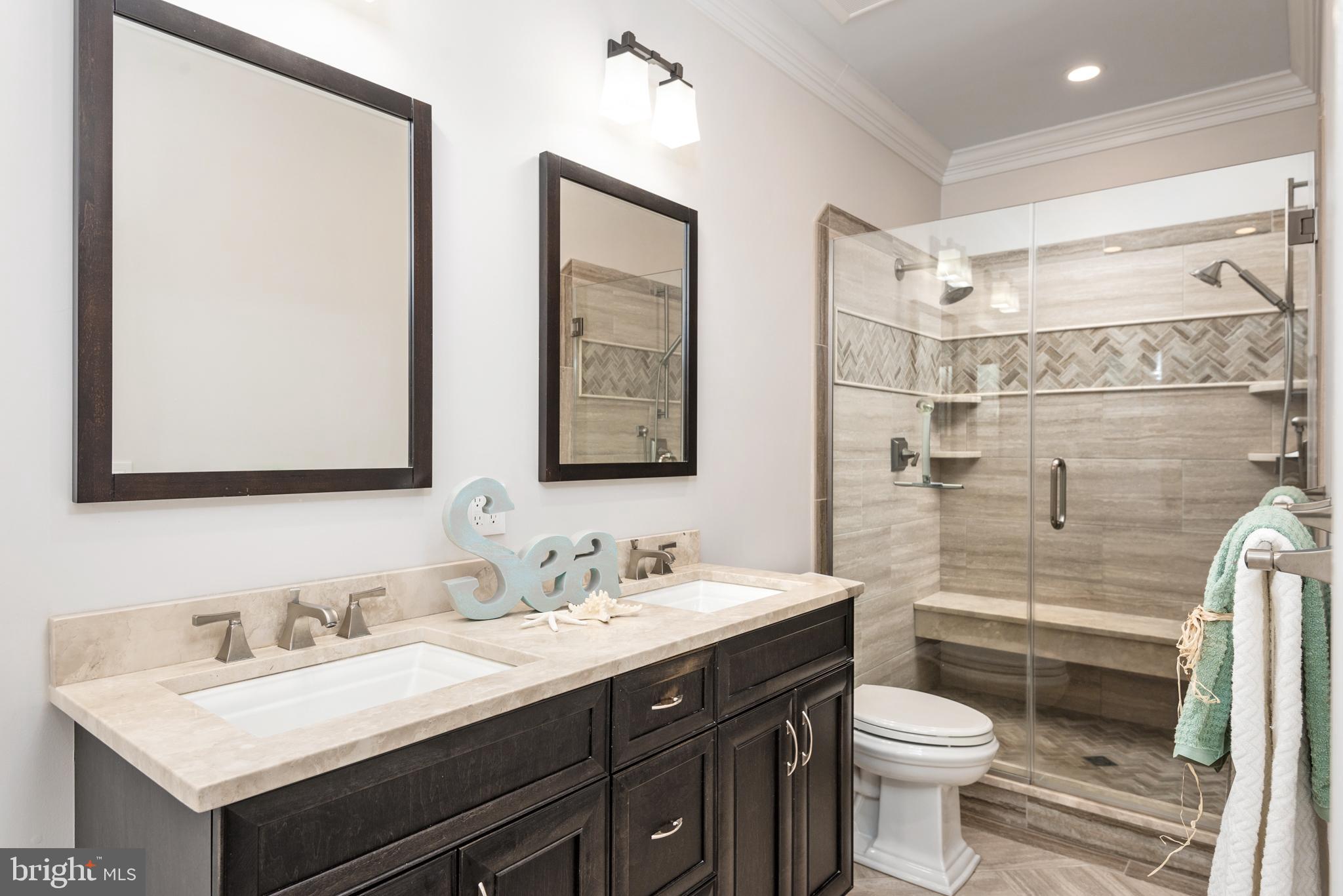 1538 Robinson Road Shady Side, MD 20764 - Photo 26 of 71 a bathroom with a double vanity sink toilet and a mirror