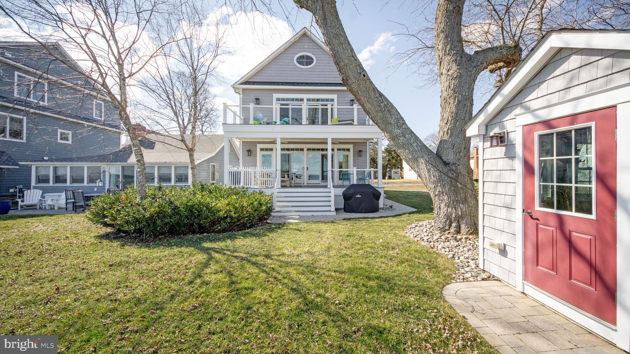 1538 Robinson Road Shady Side, MD 20764 - Photo 54 of 71 a front view of a house with yard and green space
