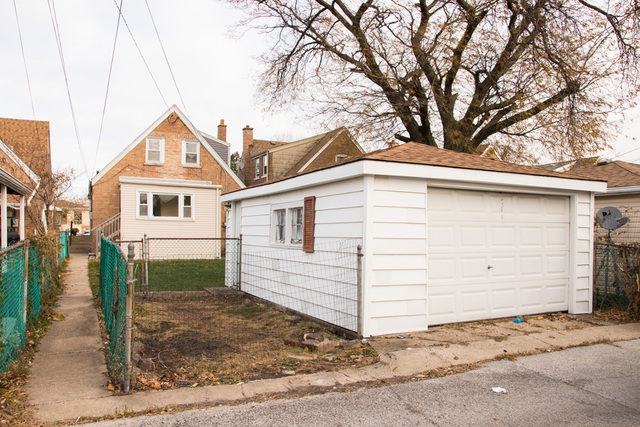 3943 West 83rd Street Chicago, IL 60652 - Photo 16 of 16 a view of a house with a yard