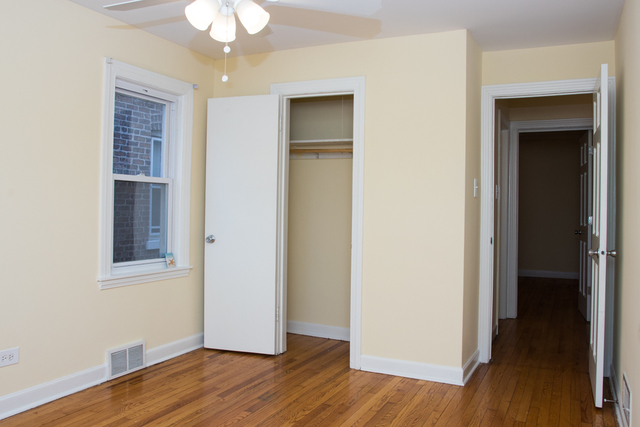 3943 West 83rd Street Chicago, IL 60652 - Photo 5 of 16 an empty room with wooden floor and closet