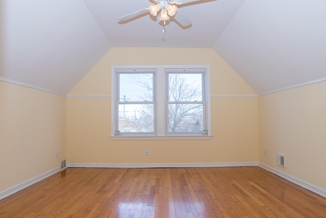 3943 West 83rd Street Chicago, IL 60652 - Photo 9 of 16 an empty room with wooden floor chandelier and window