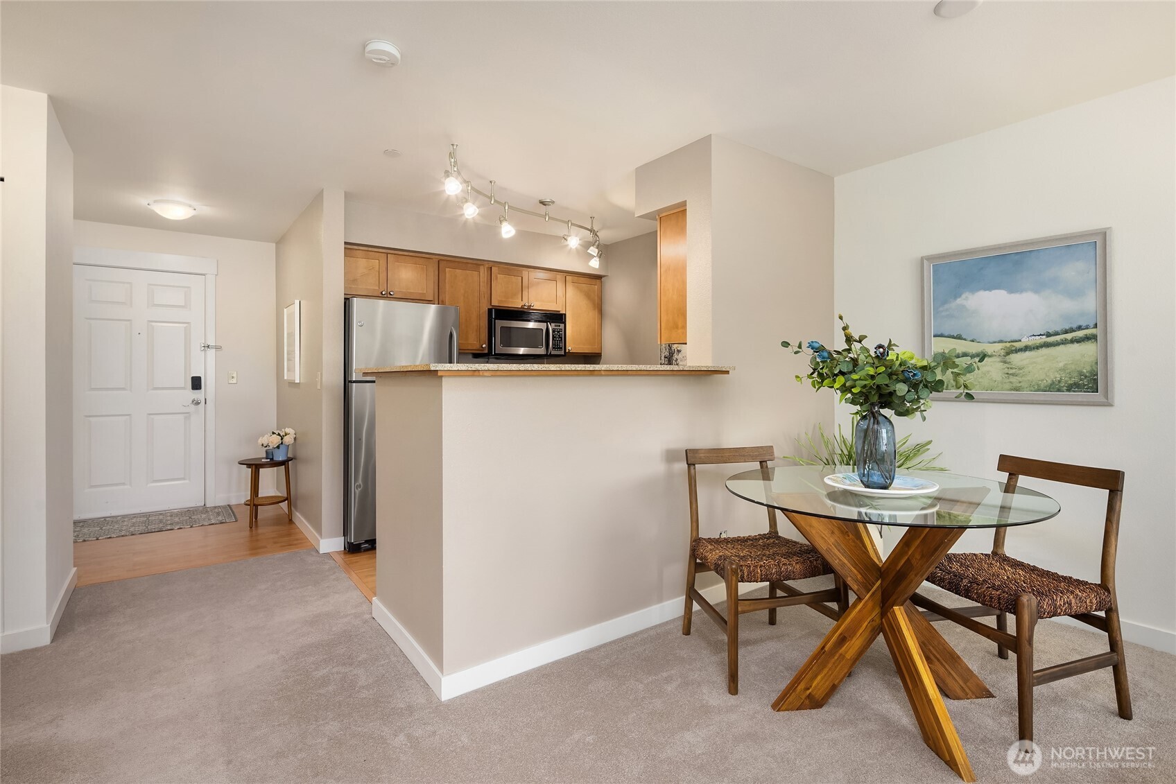 300 High School Road Northeast, Unit 304 Bainbridge Island, WA 98110 - Photo 12 of 23 a view of kitchen with furniture and a refrigerator
