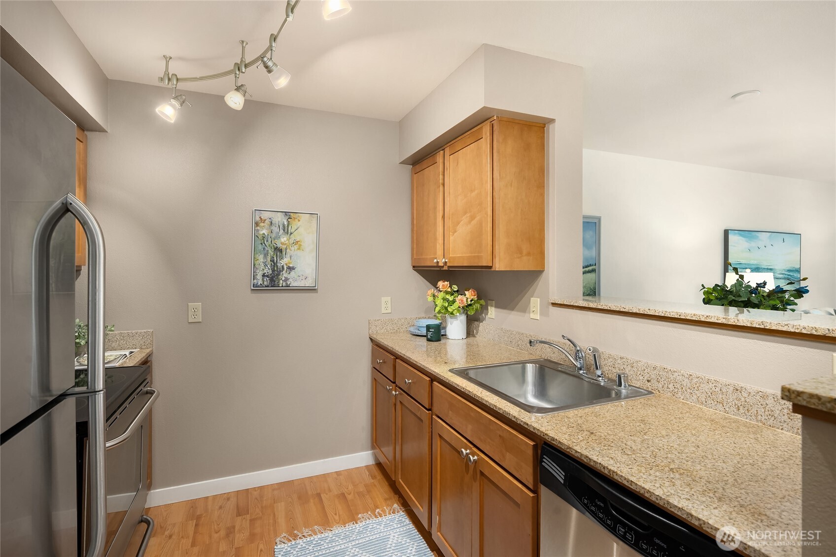 300 High School Road Northeast, Unit 304 Bainbridge Island, WA 98110 - Photo 14 of 23 a bathroom with a granite countertop sink and a mirror