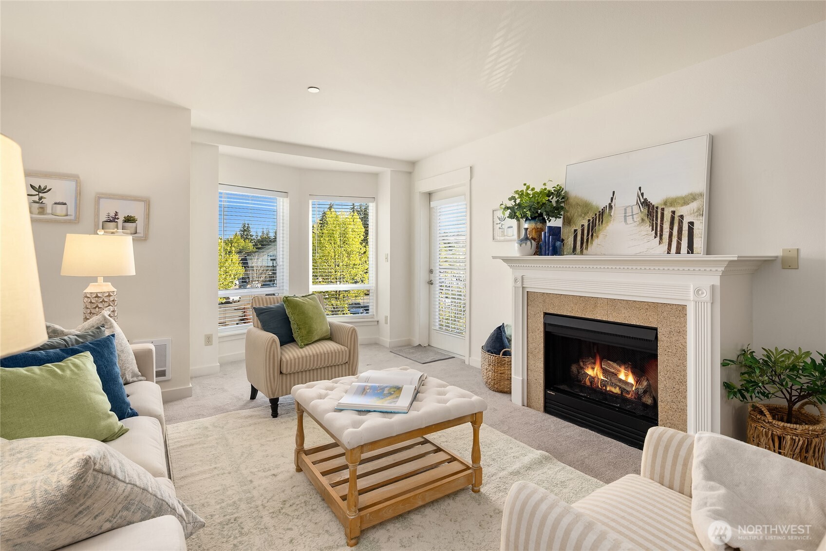 300 High School Road Northeast, Unit 304 Bainbridge Island, WA 98110 - Photo 9 of 23 a living room with furniture and a fireplace