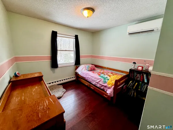 a room with furniture and a wooden floor