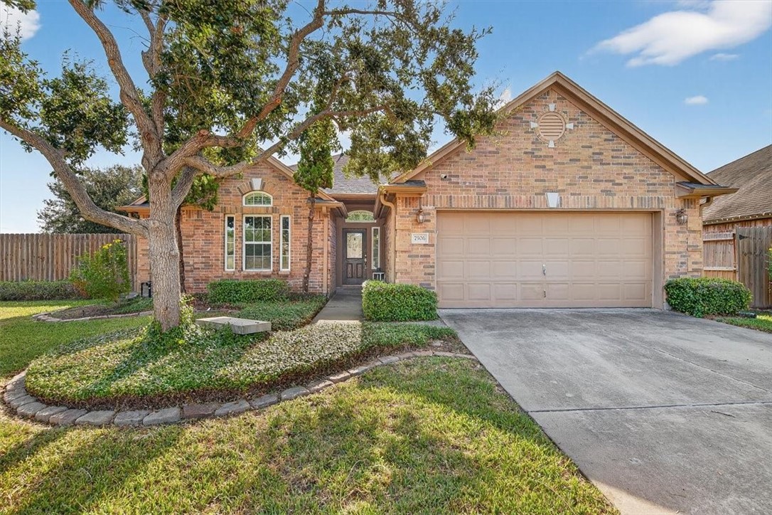 7506 Exeter Corpus Christi, TX 78414 - Photo 1 of 40 a front view of a house with a garden