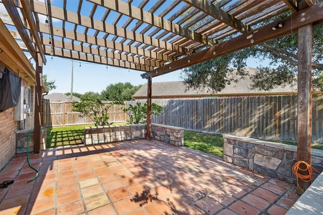 a view of a pathway with a patio