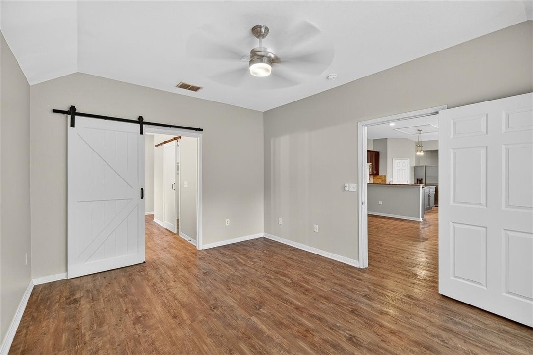7506 Exeter Corpus Christi, TX 78414 - Photo 20 of 40 a view of a livingroom with wooden floor and a ceiling fan
