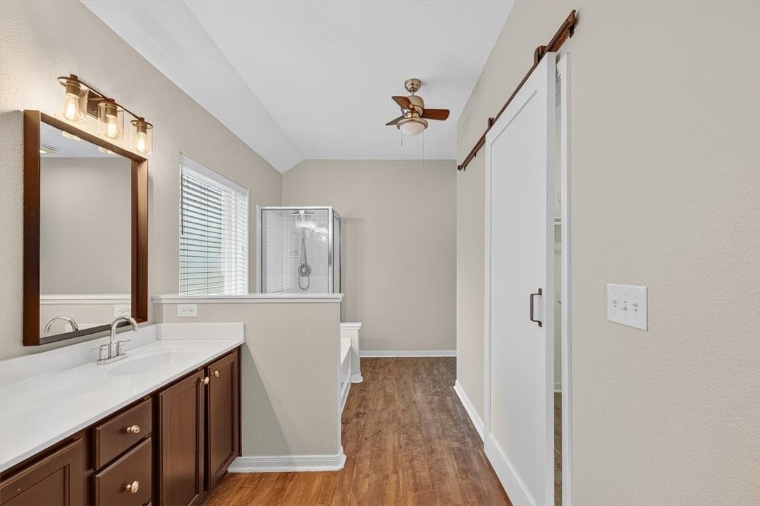 7506 Exeter Corpus Christi, TX 78414 - Photo 22 of 40 a bathroom with a sink a mirror and a shower