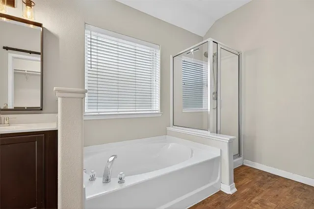 a white bath tub sitting next to a window