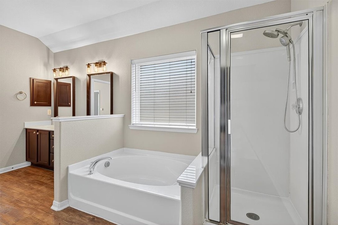 7506 Exeter Corpus Christi, TX 78414 - Photo 27 of 40 a bathroom with a tub a sink and a shower