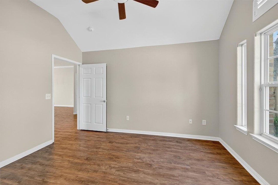 7506 Exeter Corpus Christi, TX 78414 - Photo 30 of 40 an empty room with wooden floor closet and windows