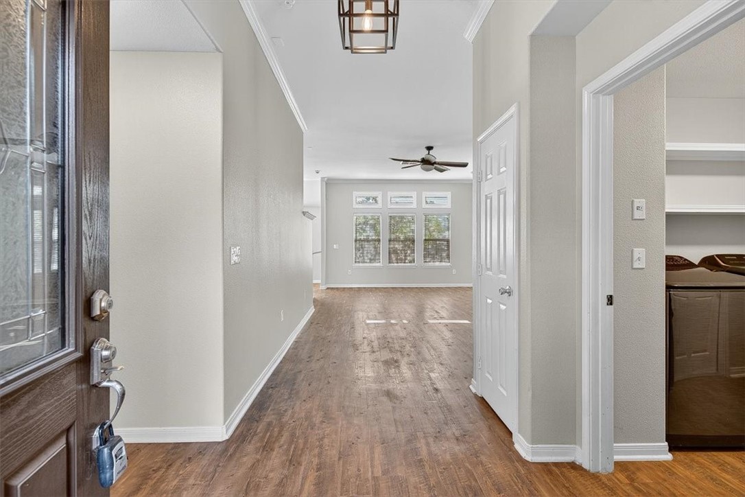 7506 Exeter Corpus Christi, TX 78414 - Photo 3 of 40 a view of hallway with wooden floor and staircase