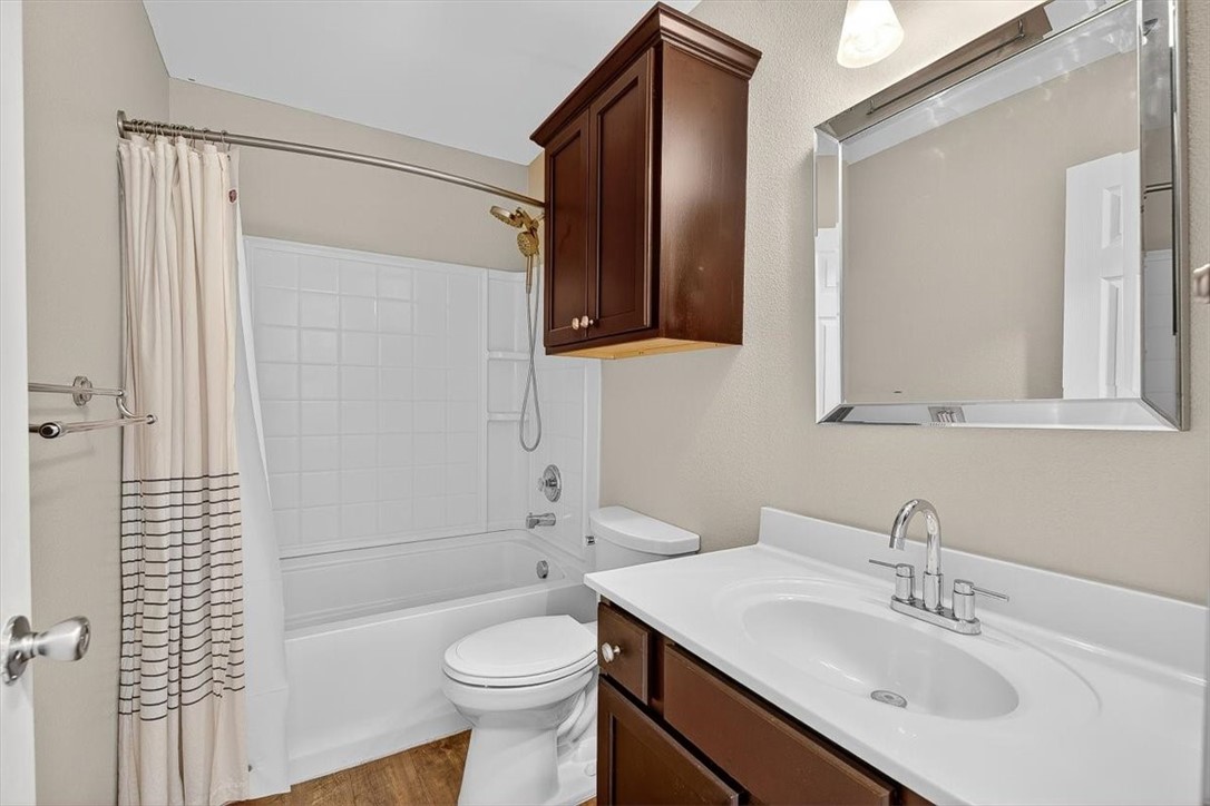 7506 Exeter Corpus Christi, TX 78414 - Photo 32 of 40 a bathroom with a sink toilet and shower