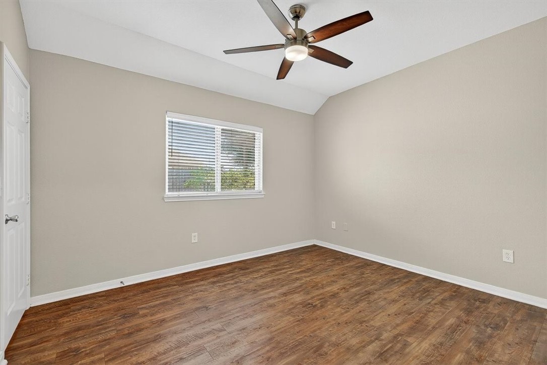 7506 Exeter Corpus Christi, TX 78414 - Photo 33 of 40 an empty room with wooden floor and windows