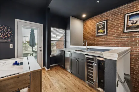 a kitchen that has a lot of cabinets a sink and a stove in it