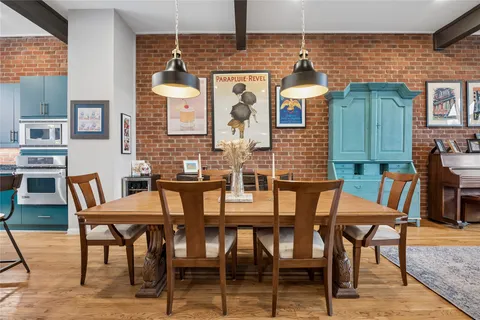 a dining room with furniture and window