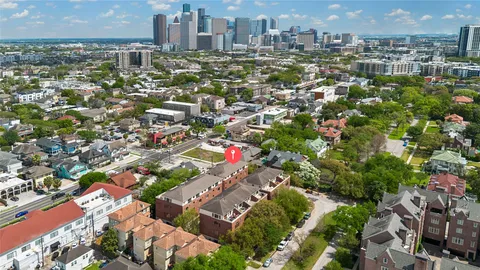 an aerial view of residential houses and outdoor space