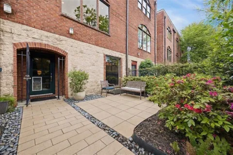 a view of a building with potted plants