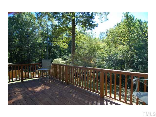 516 Princeton Street Raleigh, NC 27609 - Photo 5 of 23 a view of a wooden deck with a yard