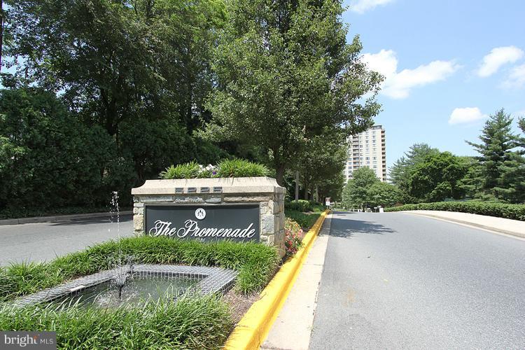 5225 Pooks Hill Road, Unit 406N Bethesda, MD 20814 - Photo 16 of 18 a view of a swimming pool with a patio