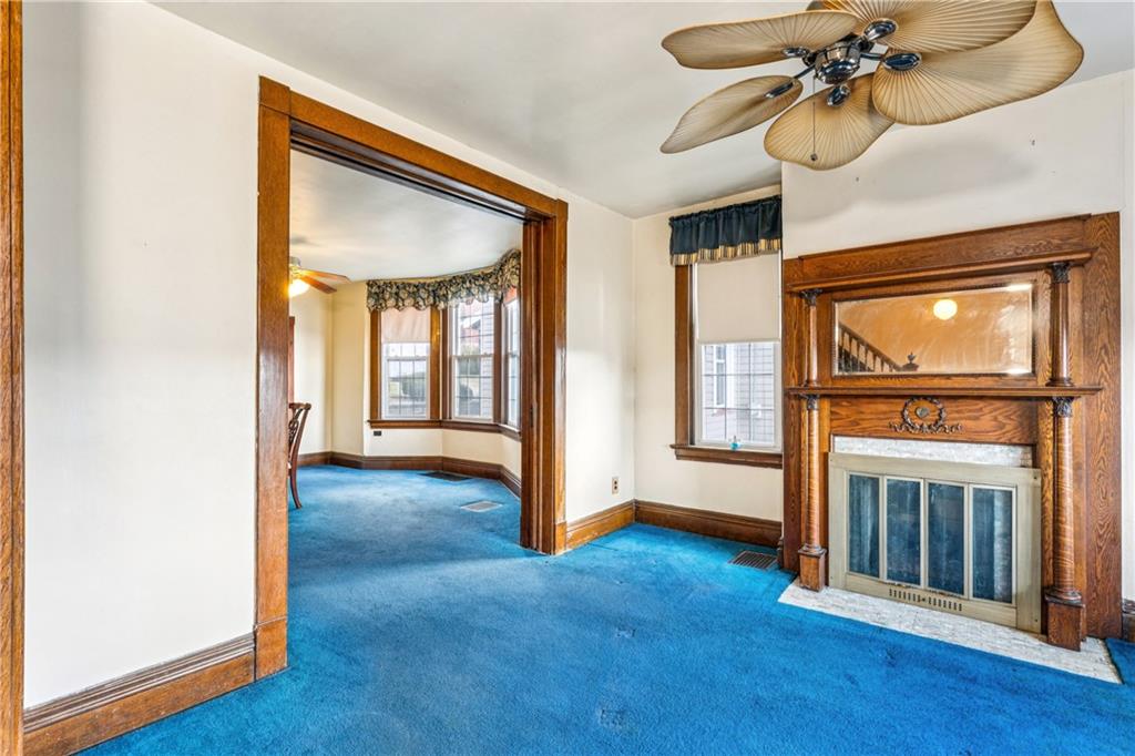 1369 5th Avenue Freedom, PA 15042 - Photo 11 of 41 a view of an empty room with a window and wooden floor