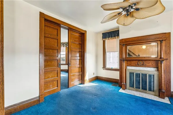 a view of a livingroom with furniture hardwood floor and a ceiling fan